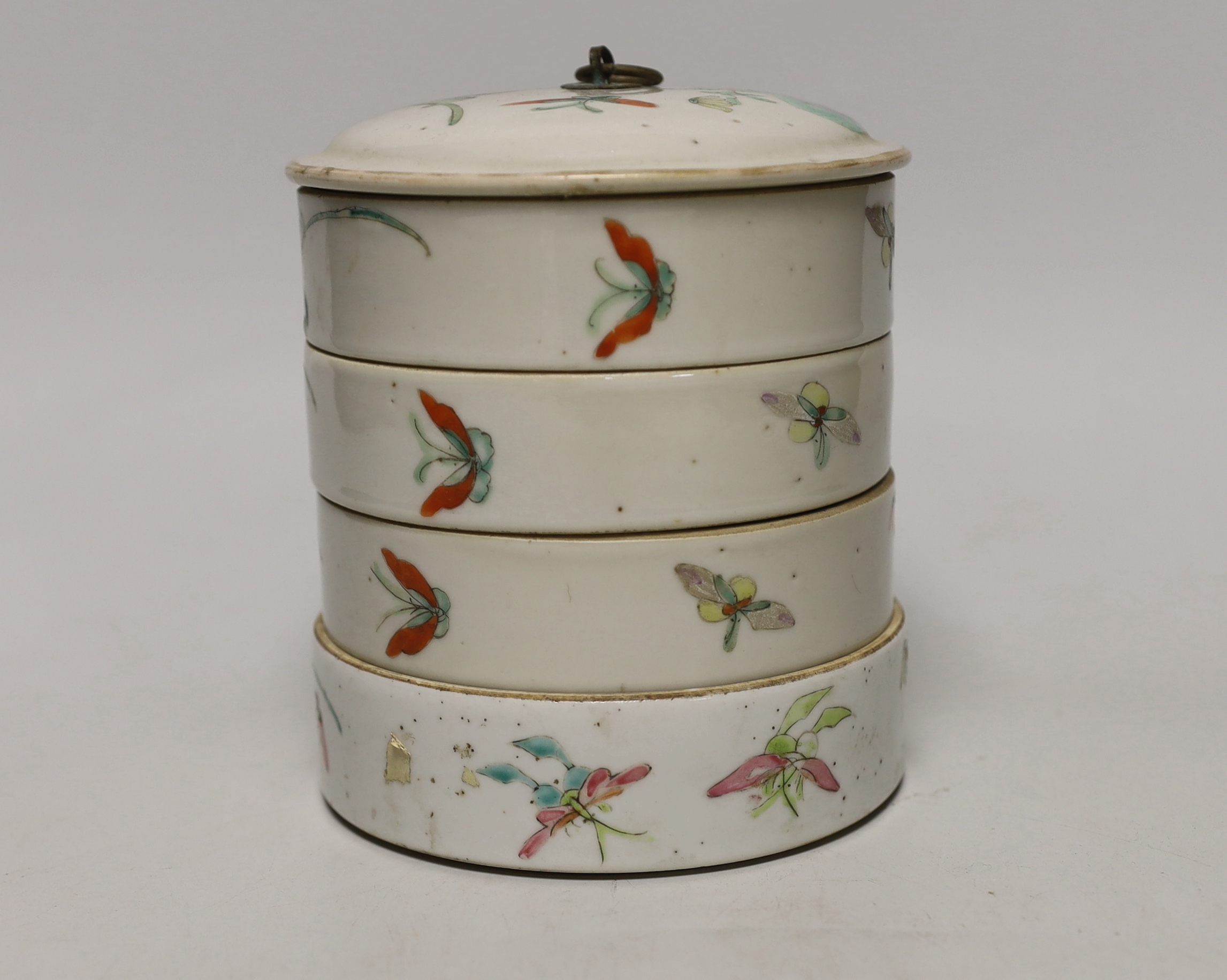 An early 20th century Chinese enamelled porcelain four section stacking food container and cover, 14cm